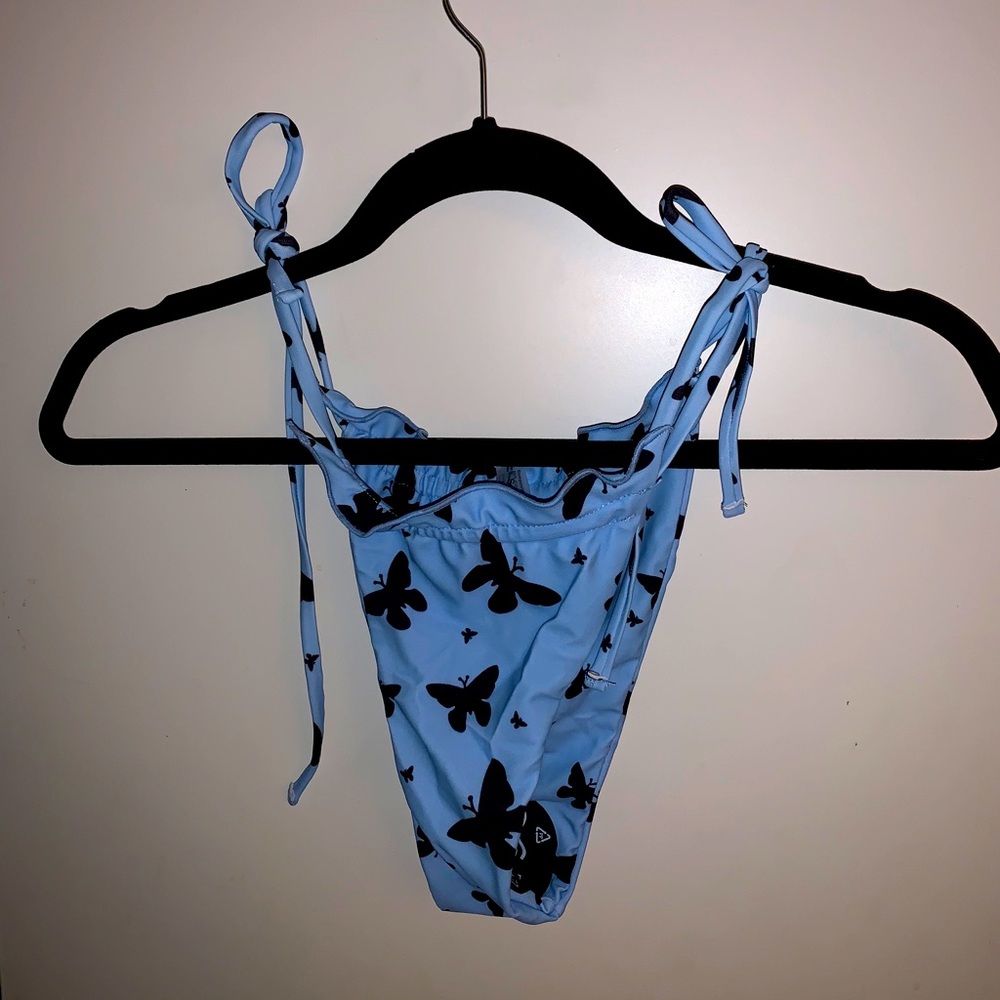 BRAND NEW blue swim bottoms w/black butterflies
